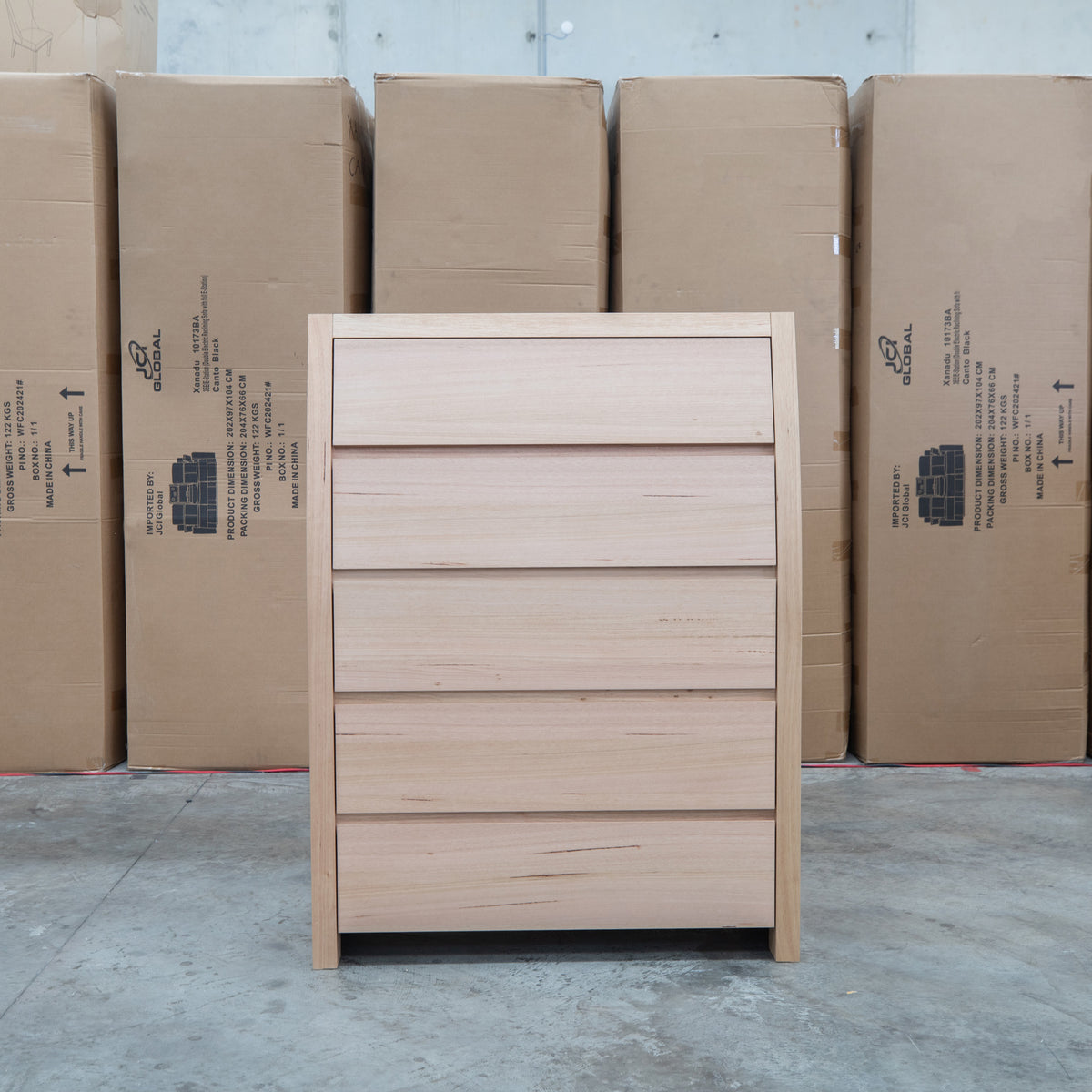 The Melba Curved Australian Messmate Five Drawer Tallboy available to purchase from Warehouse Furniture Clearance at our next sale event.