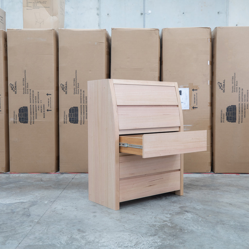 The Melba Curved Australian Messmate Five Drawer Tallboy available to purchase from Warehouse Furniture Clearance at our next sale event.