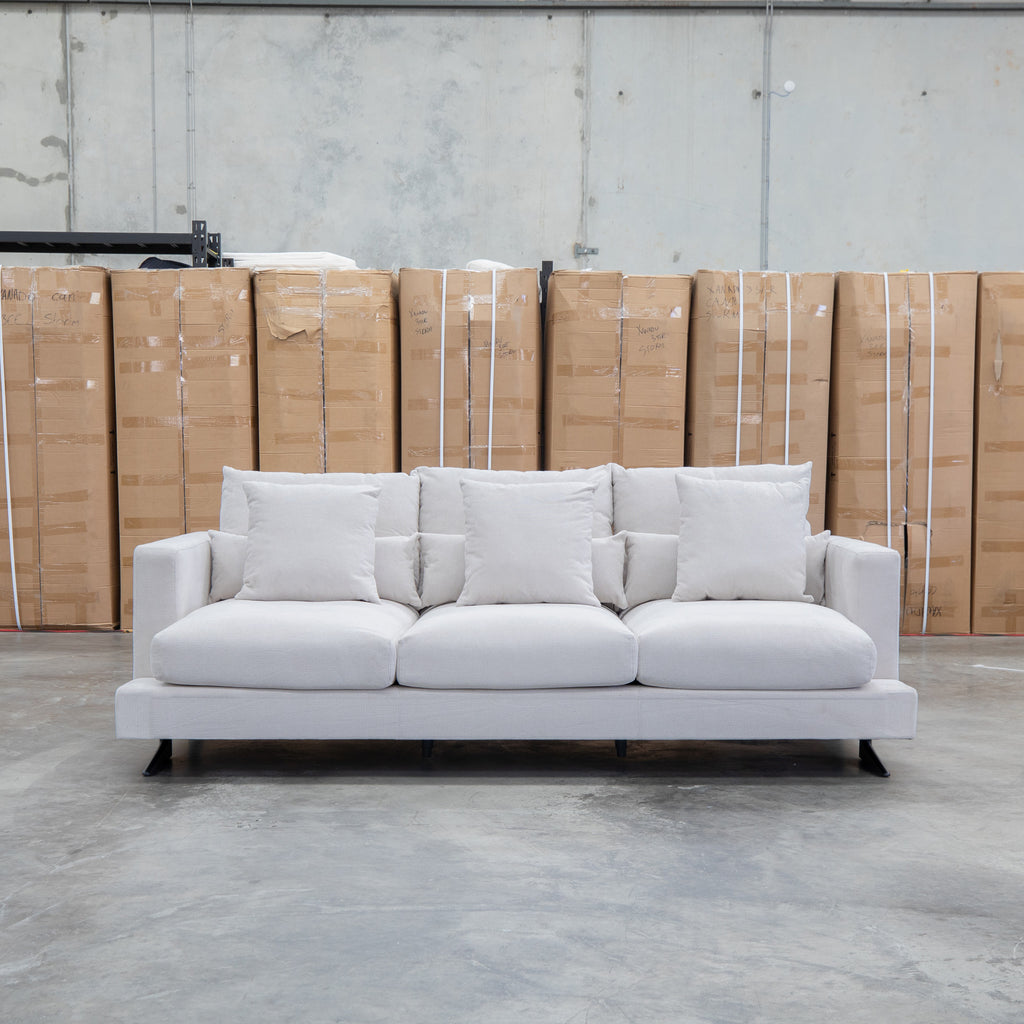 The Melbourne Deep Seat Feather & Foam Three Seat Sofa - Biscuit available to purchase from Warehouse Furniture Clearance at our next sale event.