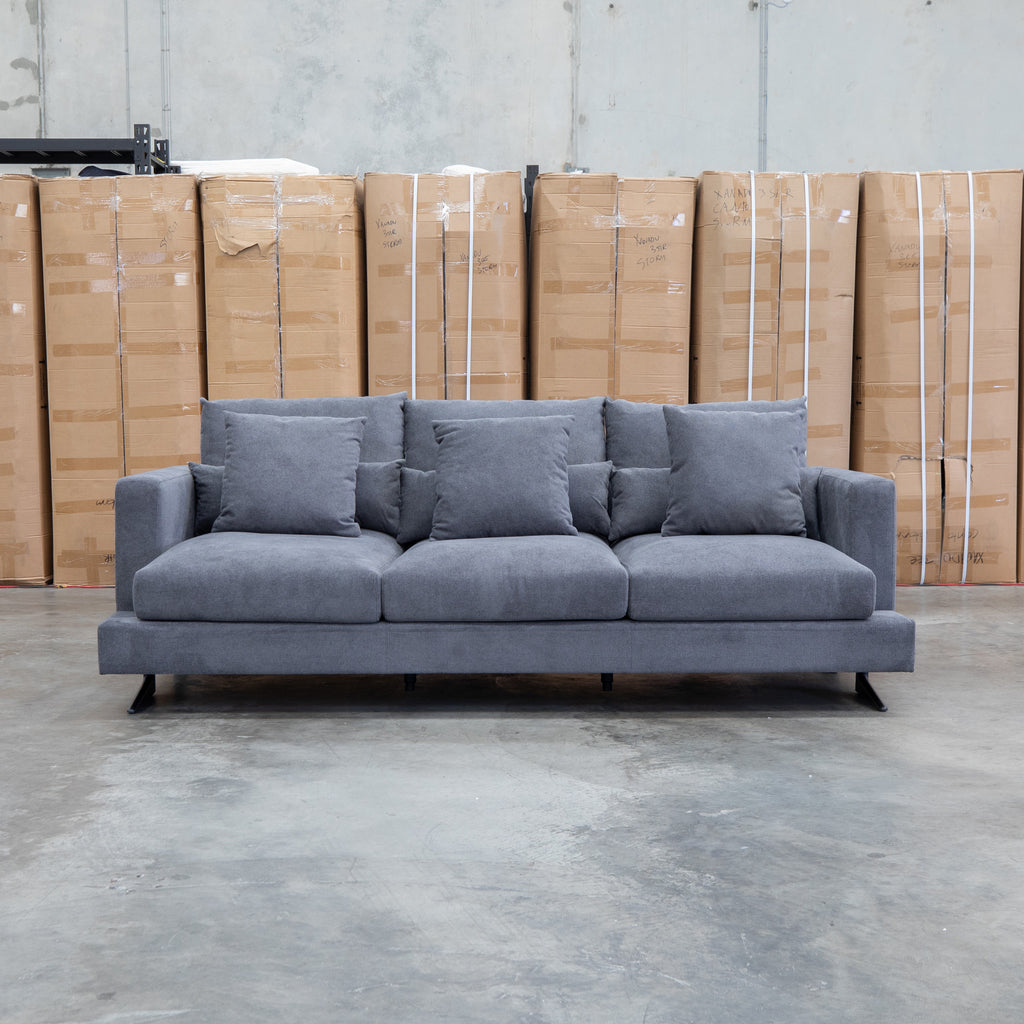 The Melbourne Deep Seat Feather & Foam Three Seat Sofa - Obsidian available to purchase from Warehouse Furniture Clearance at our next sale event.