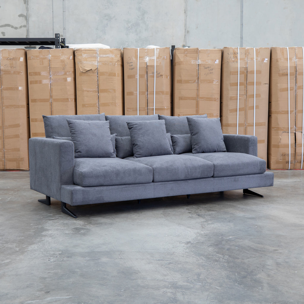 The Melbourne Deep Seat Feather & Foam Three Seat Sofa - Obsidian available to purchase from Warehouse Furniture Clearance at our next sale event.