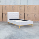 The Milos King Single Fabric Bed - Oat White available to purchase from Warehouse Furniture Clearance at our next sale event.