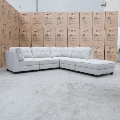The Malta Modular Corner Lounge with Ottoman - Oat available to purchase from Warehouse Furniture Clearance at our next sale event.