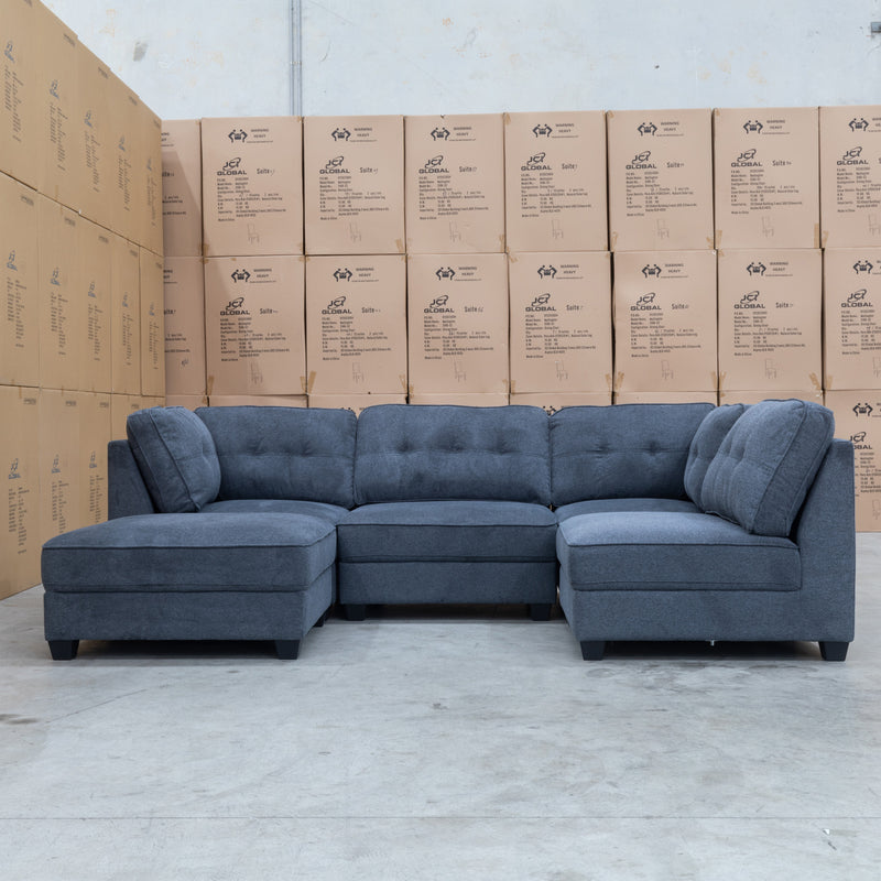 The Malta Modular Corner Lounge with Ottoman - Charcoal available to purchase from Warehouse Furniture Clearance at our next sale event.