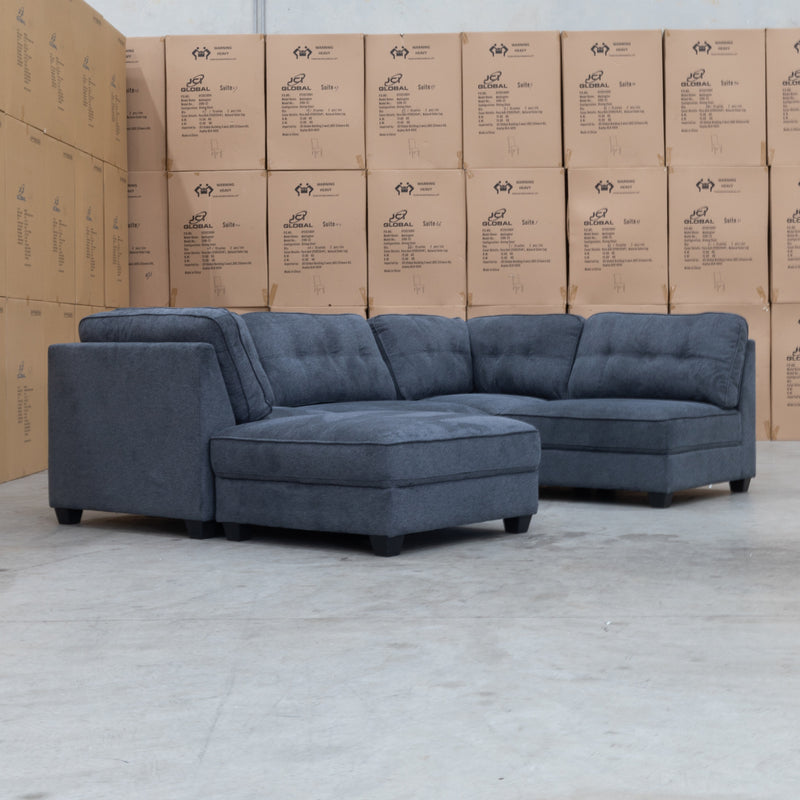 The Malta Modular Corner Lounge with Ottoman - Charcoal available to purchase from Warehouse Furniture Clearance at our next sale event.