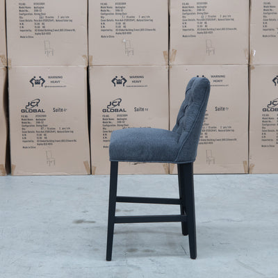 The Semillon Upholstered Black Frame Bar Stool - Charcoal available to purchase from Warehouse Furniture Clearance at our next sale event.