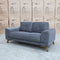 The Khloe Two Seat Fabric Sofa - Shadow available to purchase from Warehouse Furniture Clearance at our next sale event.