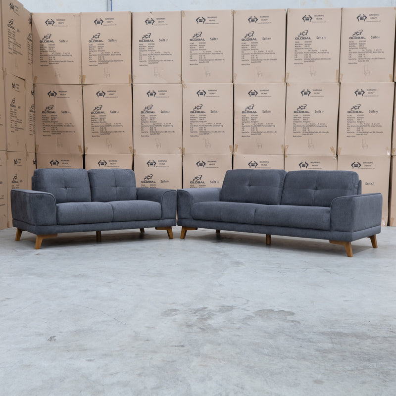 The Khloe Three Seat Fabric Sofa - Shadow available to purchase from Warehouse Furniture Clearance at our next sale event.