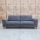 The Khloe Three Seat Fabric Sofa - Shadow available to purchase from Warehouse Furniture Clearance at our next sale event.