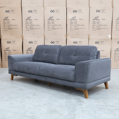 The Khloe Three Seat Fabric Sofa - Shadow available to purchase from Warehouse Furniture Clearance at our next sale event.