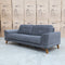 The Khloe Three Seat Fabric Sofa - Shadow available to purchase from Warehouse Furniture Clearance at our next sale event.