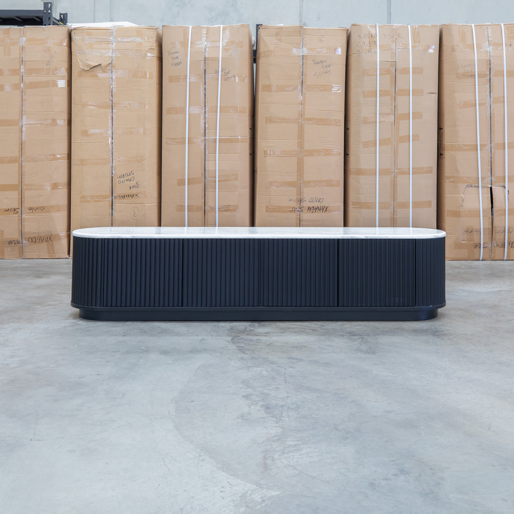 The Province 4 Door Entertainment Unit - Black & White Jazz Top available to purchase from Warehouse Furniture Clearance at our next sale event.