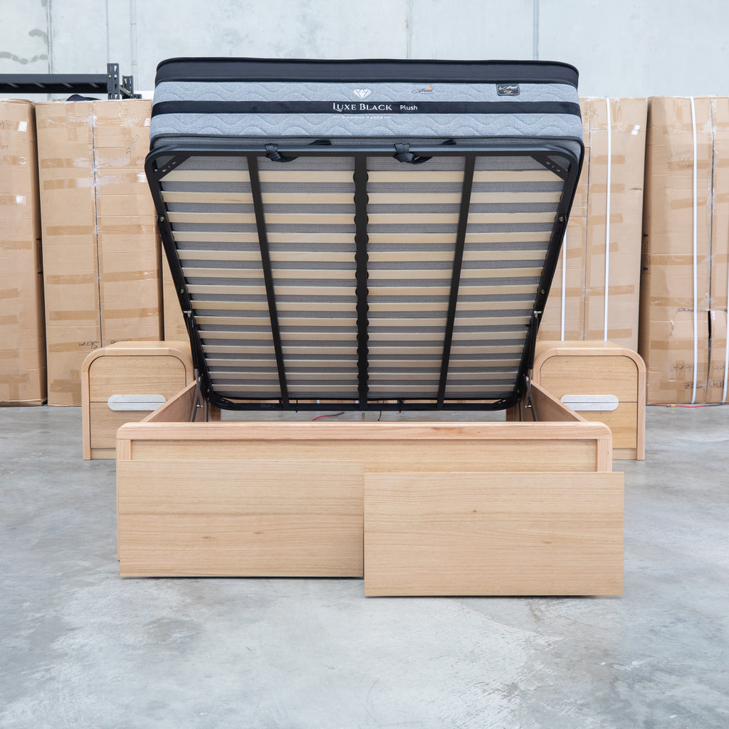 The Hastings Tasmanian Oak King Gaslift Bed with Storage Drawers available to purchase from Warehouse Furniture Clearance at our next sale event.