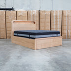 The Hastings Tasmanian Oak King Gaslift Bed with Storage Drawers available to purchase from Warehouse Furniture Clearance at our next sale event.