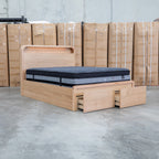 The Hastings Tasmanian Oak King Gaslift Bed with Storage Drawers available to purchase from Warehouse Furniture Clearance at our next sale event.