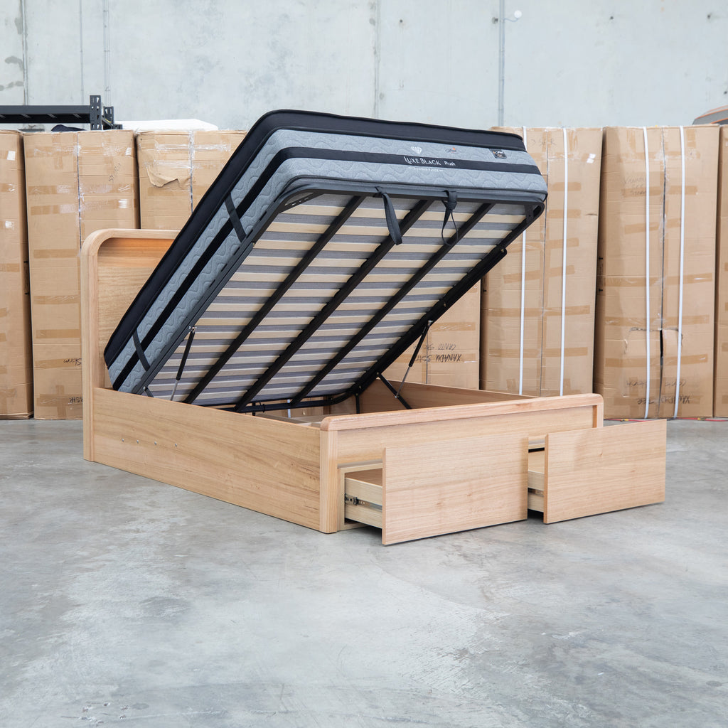 The Hastings Tasmanian Oak King Gaslift Bed with Storage Drawers available to purchase from Warehouse Furniture Clearance at our next sale event.