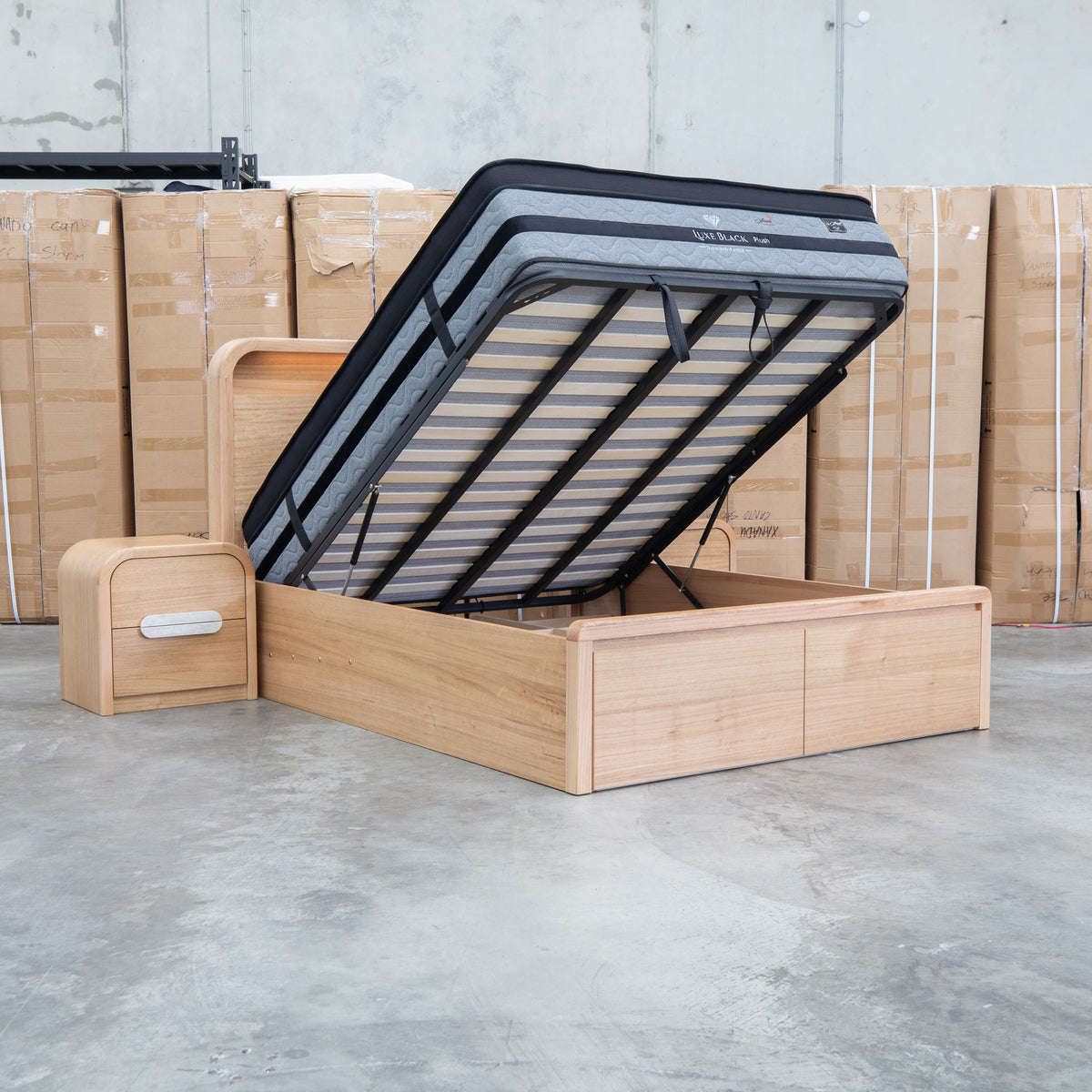 The Hastings Tasmanian Oak King Gaslift Bed with Storage Drawers available to purchase from Warehouse Furniture Clearance at our next sale event.