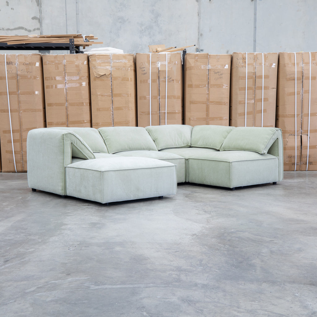 The Sienna Feather & Foam Modular Corner Lounge with Ottoman - Pistachio available to purchase from Warehouse Furniture Clearance at our next sale event.