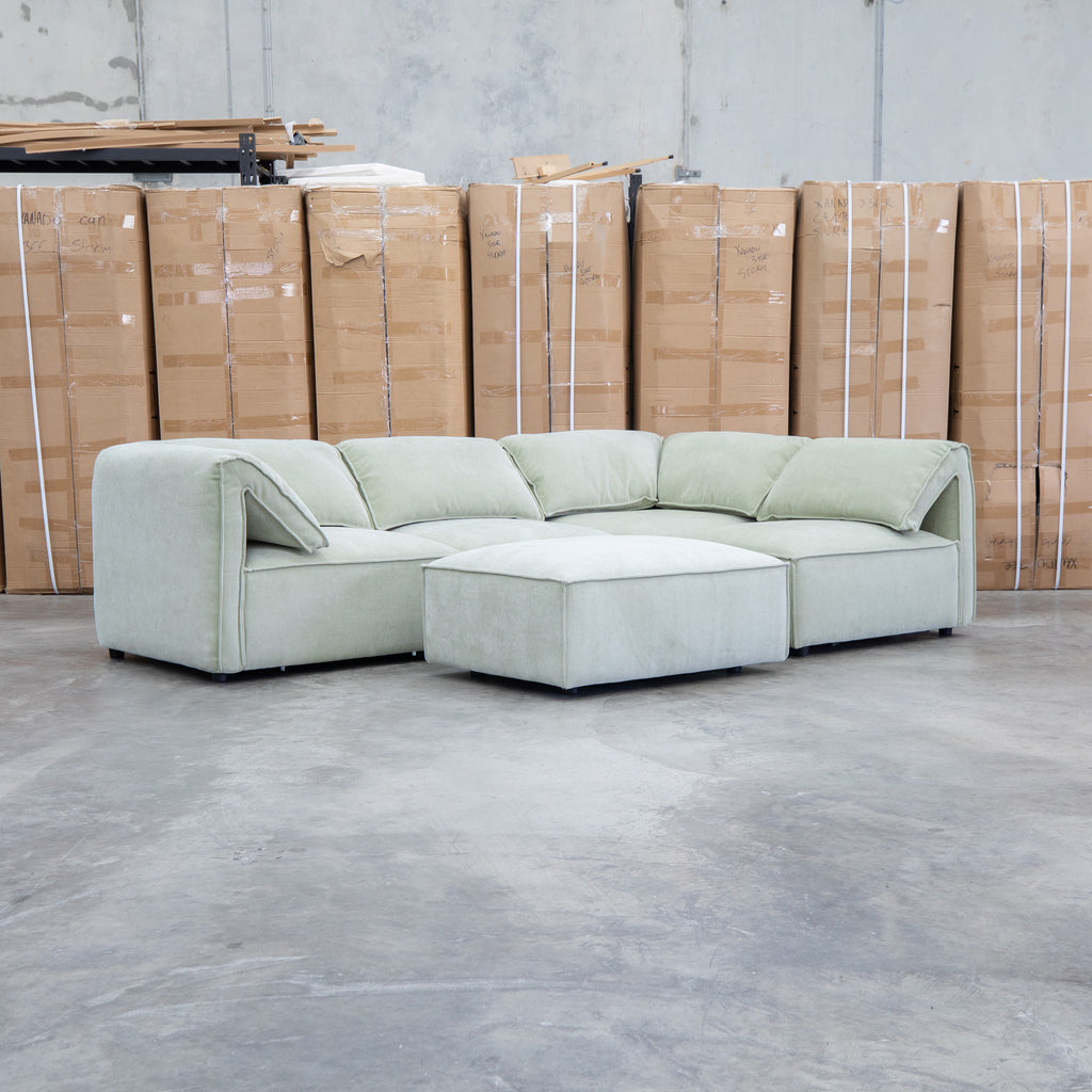 The Sienna Feather & Foam Modular Corner Lounge with Ottoman - Pistachio available to purchase from Warehouse Furniture Clearance at our next sale event.