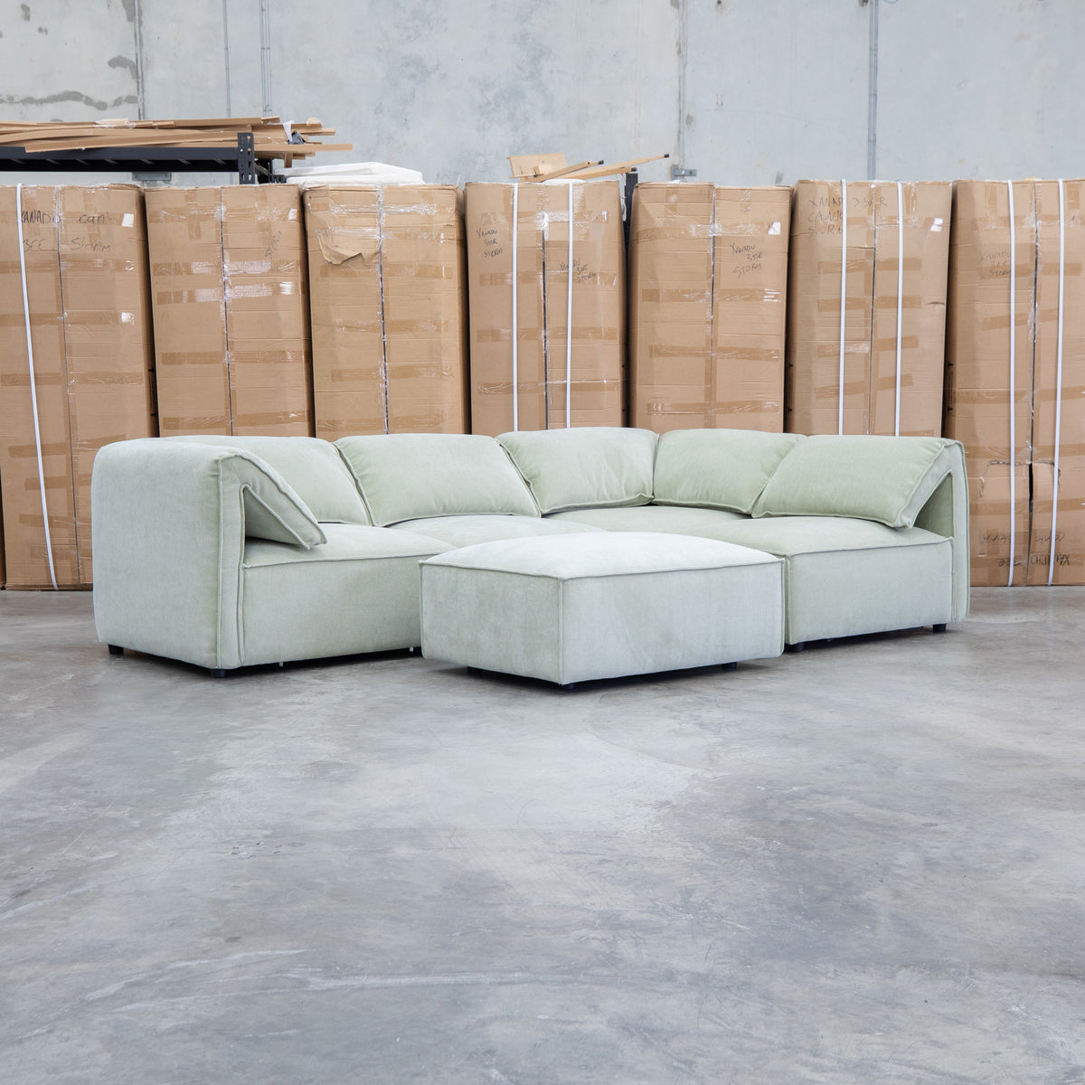 The Sienna Feather & Foam Modular Corner Lounge with Ottoman - Pistachio available to purchase from Warehouse Furniture Clearance at our next sale event.
