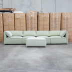 The Sienna Feather & Foam Modular Corner Lounge with Ottoman - Pistachio available to purchase from Warehouse Furniture Clearance at our next sale event.