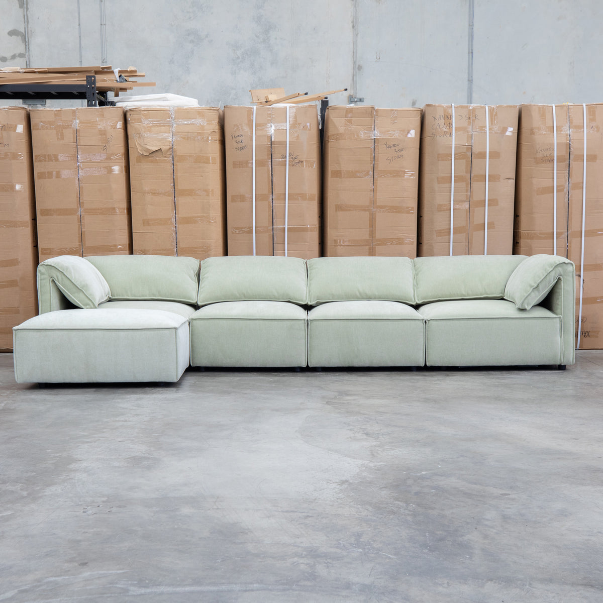 The Sienna Feather & Foam Modular Corner Lounge with Ottoman - Pistachio available to purchase from Warehouse Furniture Clearance at our next sale event.