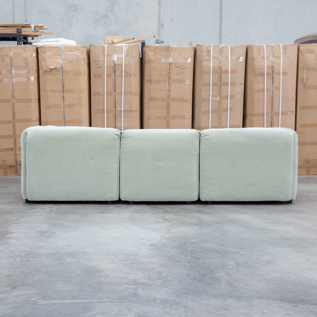 The Sienna Feather & Foam Modular Corner Lounge with Ottoman - Pistachio available to purchase from Warehouse Furniture Clearance at our next sale event.