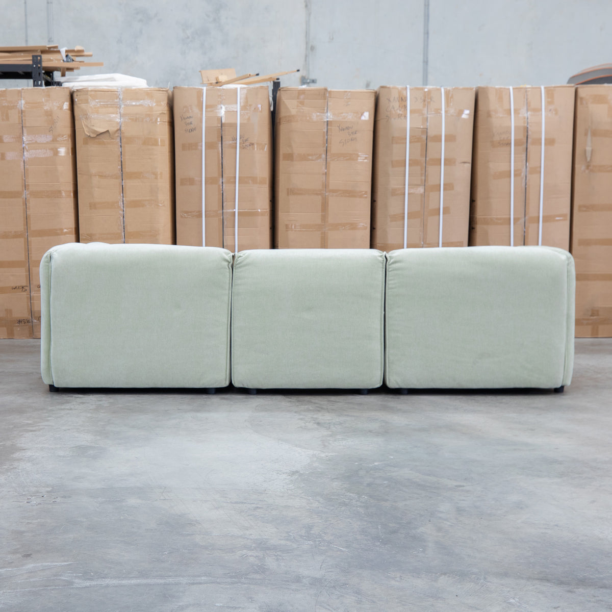 The Sienna Feather & Foam Modular Corner Lounge with Ottoman - Pistachio available to purchase from Warehouse Furniture Clearance at our next sale event.