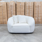 The Sienna Oversized Swivel Chair - Snow Veda available to purchase from Warehouse Furniture Clearance at our next sale event.