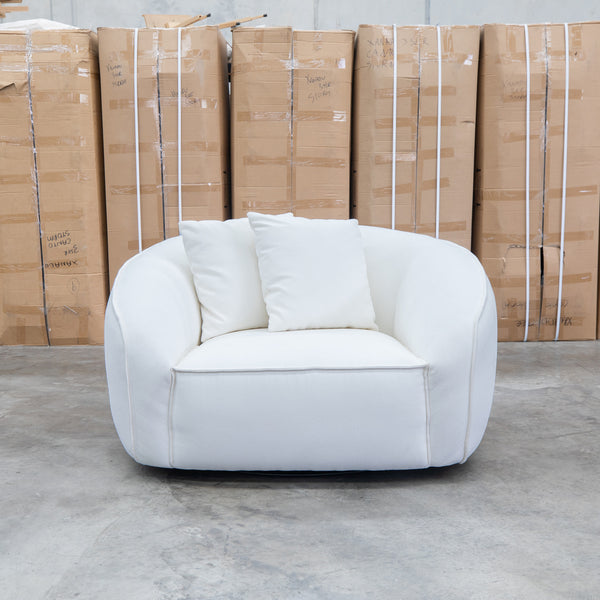 The Sienna Oversized Swivel Chair - Snow Veda available to purchase from Warehouse Furniture Clearance at our next sale event.