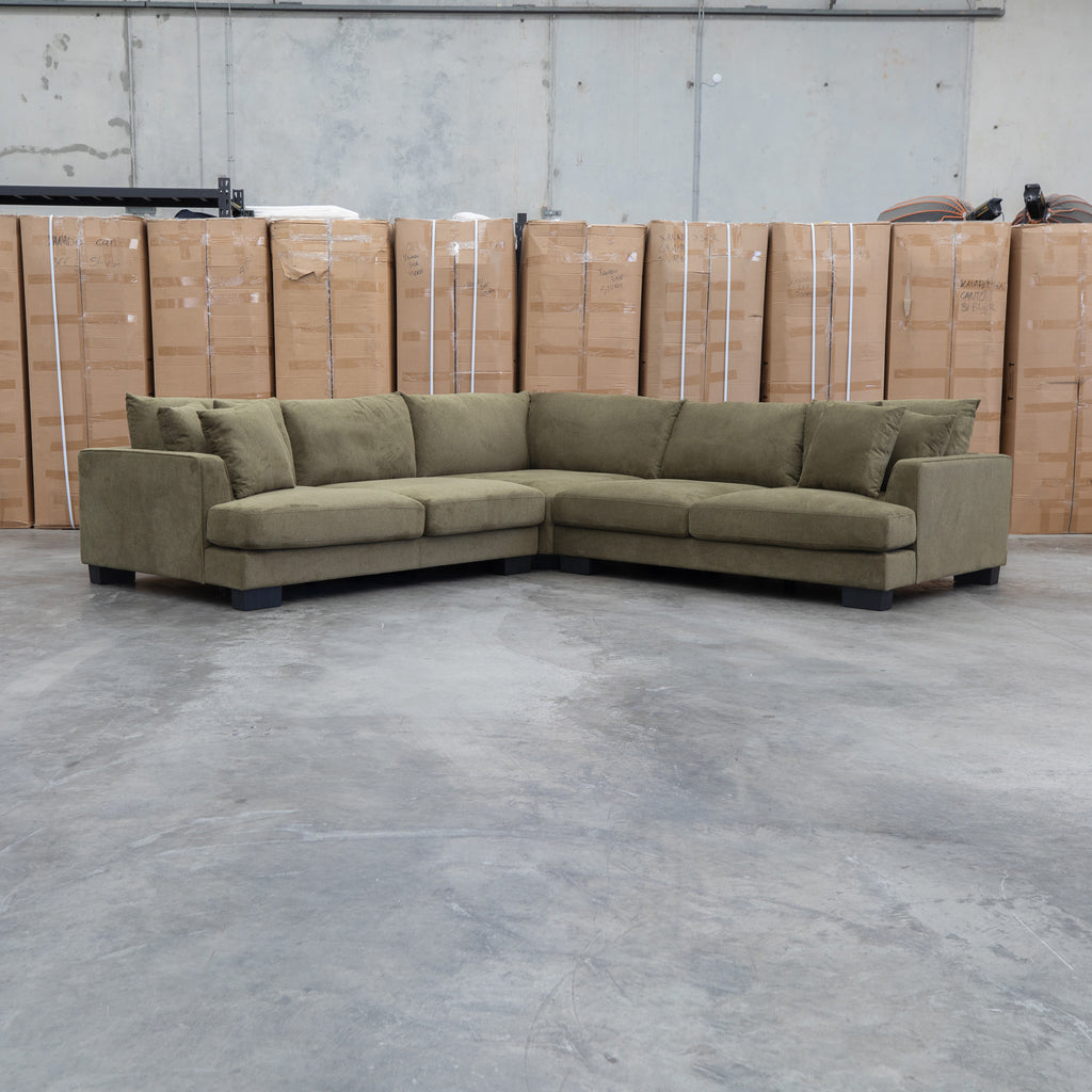 The Adelina Deep Seated Corner Lounge - Moss Green available to purchase from Warehouse Furniture Clearance at our next sale event.