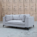 The Alara Two Seat Fabric Lounge - Light Grey available to purchase from Warehouse Furniture Clearance at our next sale event.