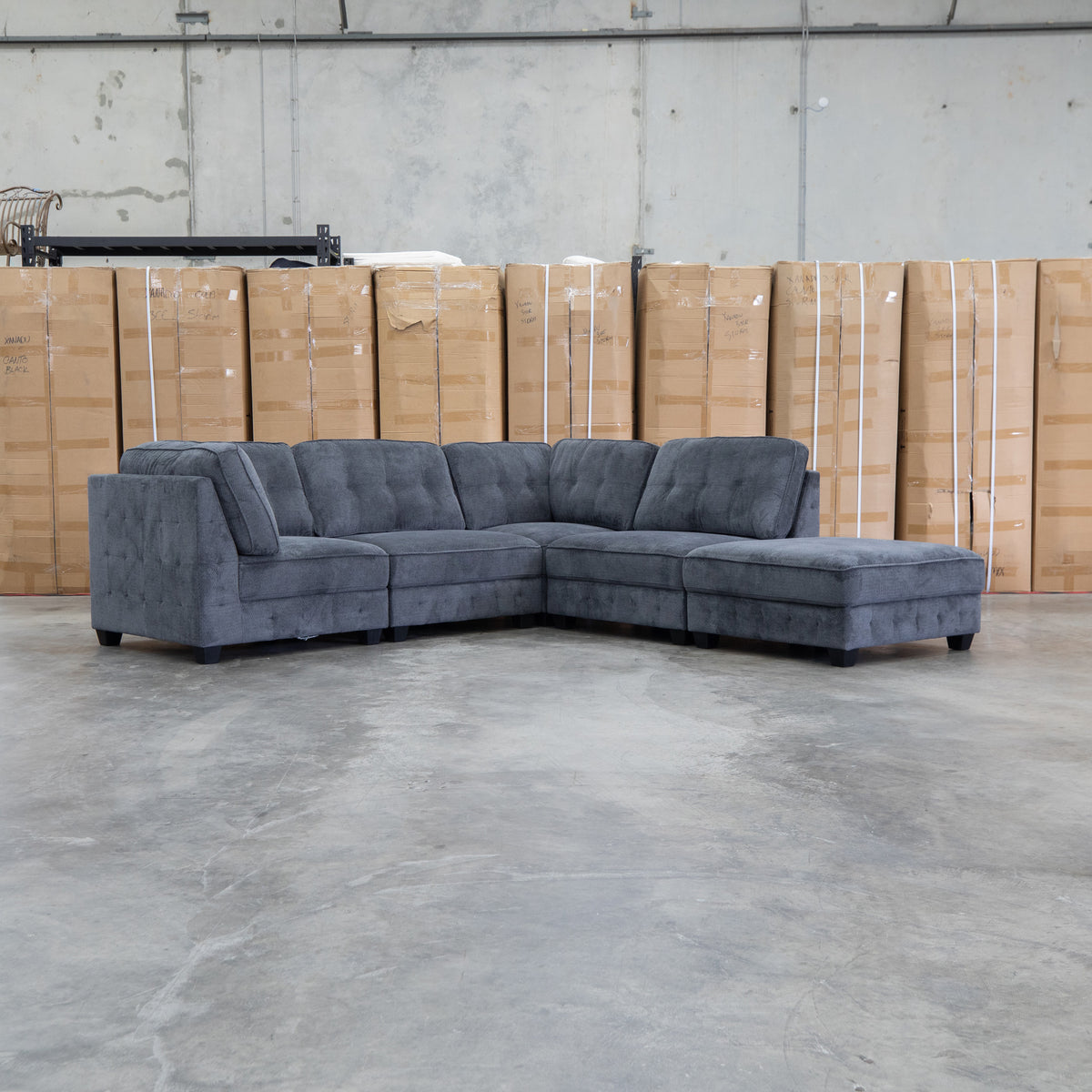 The Nobu Modular Corner Lounge with Ottoman - Carbon - PRE ORDER Available After 5th November available to purchase from Warehouse Furniture Clearance at our next sale event.