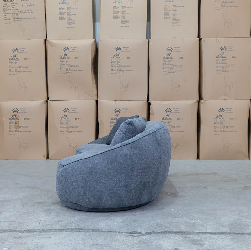 The Noosa Curved Fabric Three Seat Sofa - Dark Grey available to purchase from Warehouse Furniture Clearance at our next sale event.