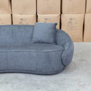 The Noosa Curved Fabric Three Seat Sofa - Dark Grey available to purchase from Warehouse Furniture Clearance at our next sale event.