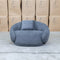 The Noosa Curved Fabric Armchair - Dark Grey available to purchase from Warehouse Furniture Clearance at our next sale event.