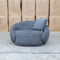 The Noosa Curved Fabric Armchair - Dark Grey available to purchase from Warehouse Furniture Clearance at our next sale event.