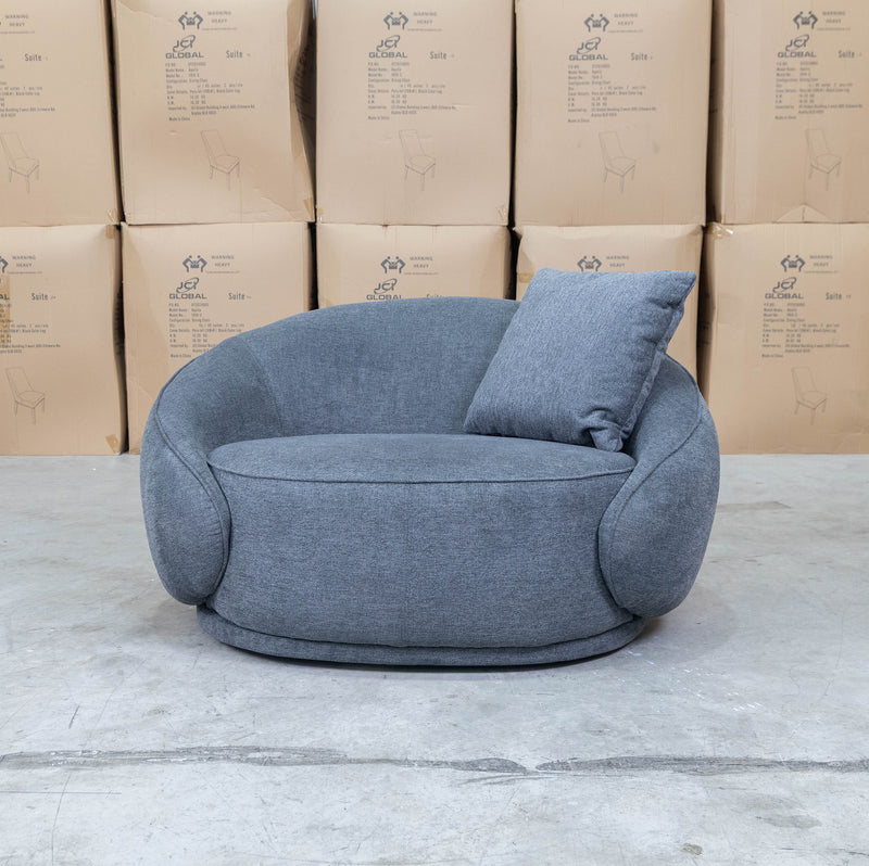 The Noosa Curved Fabric Armchair - Dark Grey available to purchase from Warehouse Furniture Clearance at our next sale event.