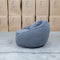 The Noosa Curved Fabric Armchair - Dark Grey available to purchase from Warehouse Furniture Clearance at our next sale event.