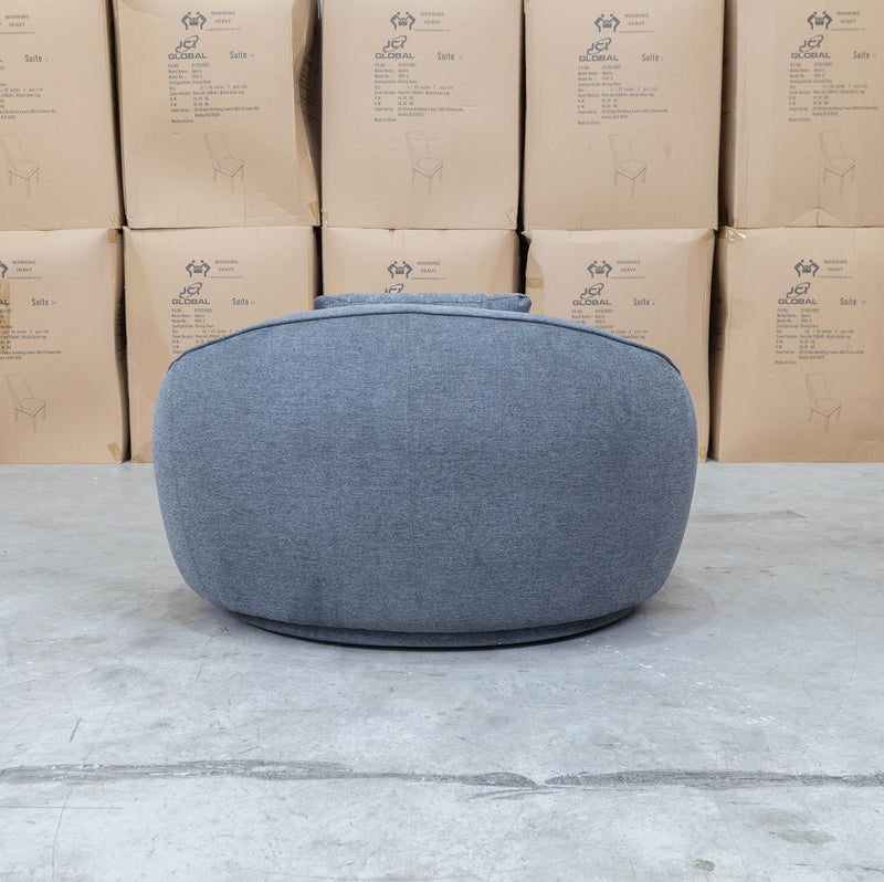 The Noosa Curved Fabric Armchair - Dark Grey available to purchase from Warehouse Furniture Clearance at our next sale event.