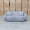 The Noosa Curved Fabric Two Seat Sofa - Light Grey available to purchase from Warehouse Furniture Clearance at our next sale event.