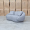 The Noosa Curved Fabric Two Seat Sofa - Light Grey available to purchase from Warehouse Furniture Clearance at our next sale event.