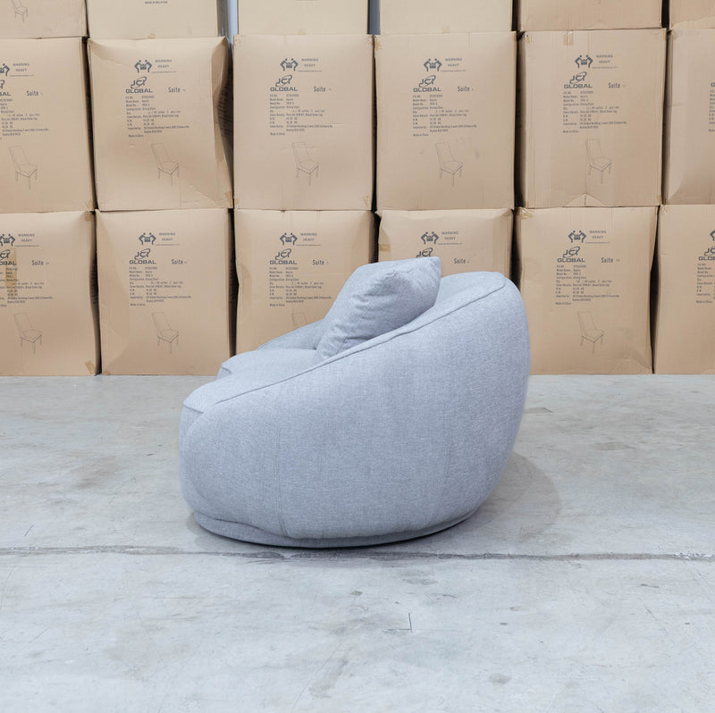 The Noosa Curved Fabric Two Seat Sofa - Light Grey available to purchase from Warehouse Furniture Clearance at our next sale event.