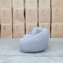 The Noosa Curved Fabric Three Seat Sofa - Light Grey available to purchase from Warehouse Furniture Clearance at our next sale event.