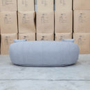 The Noosa Curved Fabric Three Seat Sofa - Light Grey available to purchase from Warehouse Furniture Clearance at our next sale event.