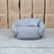 The Noosa Curved Fabric Armchair - Light Grey available to purchase from Warehouse Furniture Clearance at our next sale event.