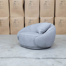 The Noosa Curved Fabric Armchair - Light Grey available to purchase from Warehouse Furniture Clearance at our next sale event.