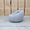 The Noosa Curved Fabric Armchair - Light Grey available to purchase from Warehouse Furniture Clearance at our next sale event.