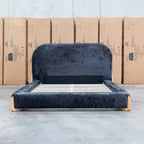 The Okina King Upholstered Bed - Black available to purchase from Warehouse Furniture Clearance at our next sale event.