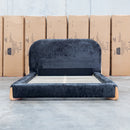 The Okina King Upholstered Bed - Black available to purchase from Warehouse Furniture Clearance at our next sale event.